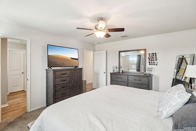 bedroom featuring carpet, baseboards, and ceiling fan
