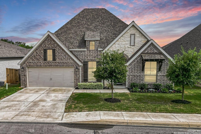 14206 Swift Breeze, San Antonio, TX 78254 - view of front of home with brick siding, a front lawn, driveway, and roof with shingles