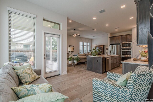 14206 Swift Breeze, San Antonio, TX 78254 - living area featuring light wood-style floors, recessed lighting, and ceiling fan