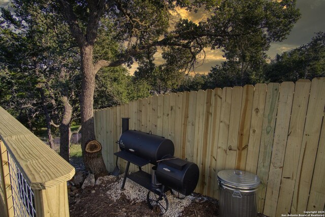 1139 Cedar Bnd, Canyon Lake, TX 78133 - view of patio featuring fence and area for grilling