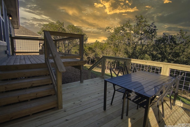 1139 Cedar Bnd, Canyon Lake, TX 78133 - deck at dusk featuring outdoor dining area
