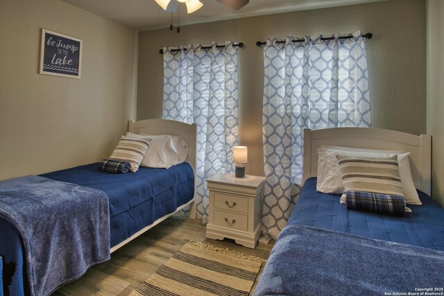 1139 Cedar Bnd, Canyon Lake, TX 78133 - bedroom featuring wood finished floors