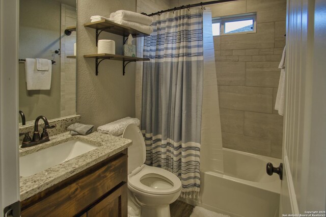 1139 Cedar Bnd, Canyon Lake, TX 78133 - full bath featuring a textured wall, shower / tub combo with curtain, toilet, and vanity