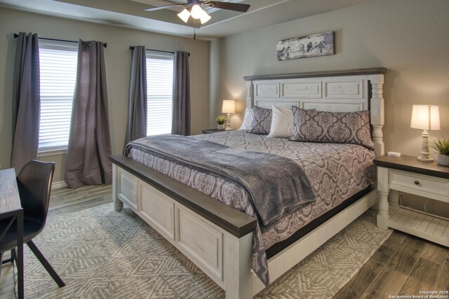 1139 Cedar Bnd, Canyon Lake, TX 78133 - bedroom featuring wood finished floors, ceiling fan, and baseboards