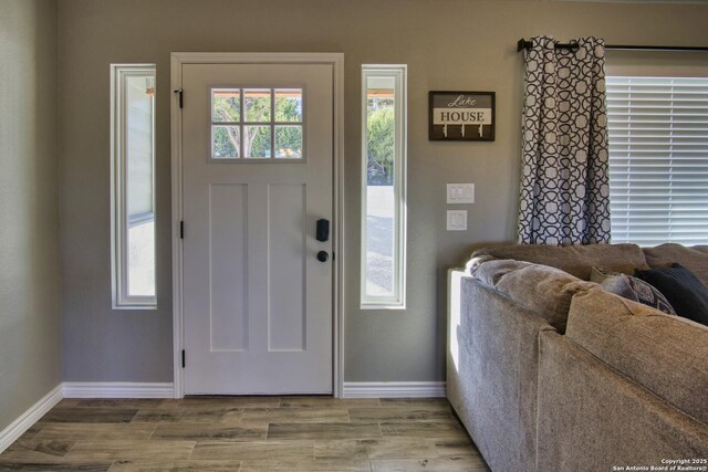 1139 Cedar Bnd, Canyon Lake, TX 78133 - foyer featuring baseboards and wood finished floors