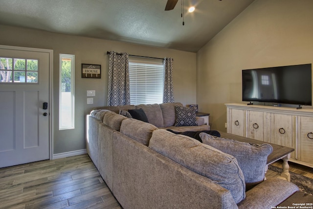 1139 Cedar Bnd, Canyon Lake, TX 78133 - living room with ceiling fan, wood finished floors, vaulted ceiling, and baseboards