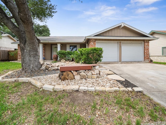 ranch-style house with driveway, an attached garage, and brick siding