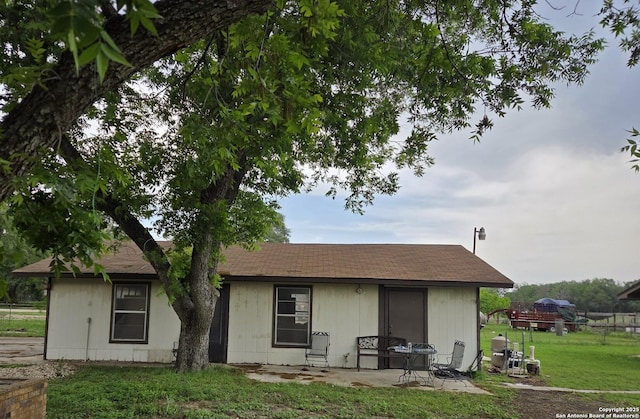 10180 Aliann, Atascosa, TX 78002 - rear view of house featuring a yard and a patio