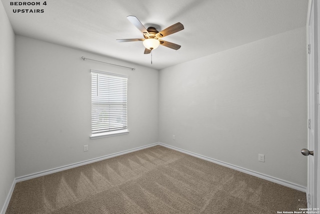 unfurnished room with a ceiling fan, carpet floors, and baseboards