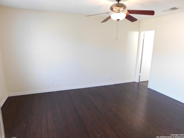 8918 Kenton Mist, San Antonio, TX 78240 - unfurnished room featuring dark wood-style floors, a ceiling fan, and baseboards