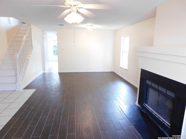 8918 Kenton Mist, San Antonio, TX 78240 - unfurnished living room featuring a fireplace, wood finished floors, stairway, baseboards, and ceiling fan