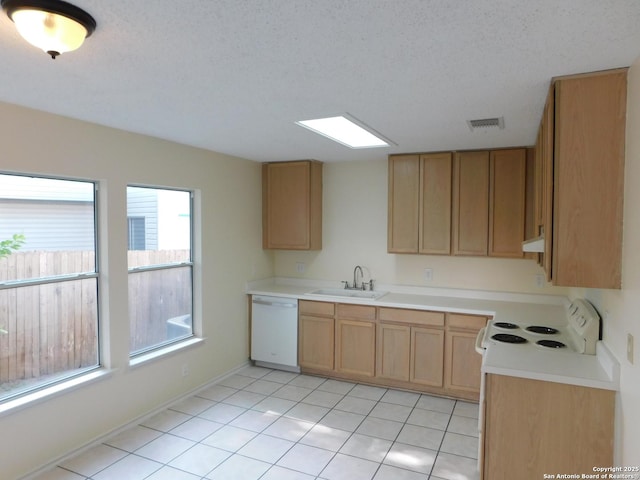 8918 Kenton Mist, San Antonio, TX 78240 - kitchen featuring white appliances, a sink, light countertops, light tile patterned floors, and light brown cabinetry