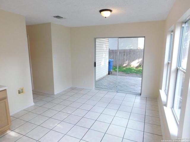 8918 Kenton Mist, San Antonio, TX 78240 - spare room featuring light tile patterned floors and baseboards