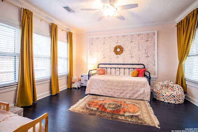 243 N, San Antonio, TX 78201 - bedroom featuring a textured ceiling, wood finished floors, baseboards, ceiling fan, and ornamental molding