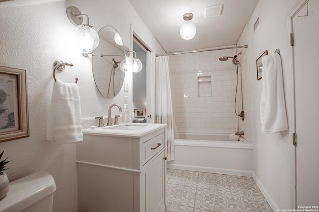 243 N, San Antonio, TX 78201 - bathroom featuring vanity, shower / tub combo with curtain, toilet, and tile patterned flooring