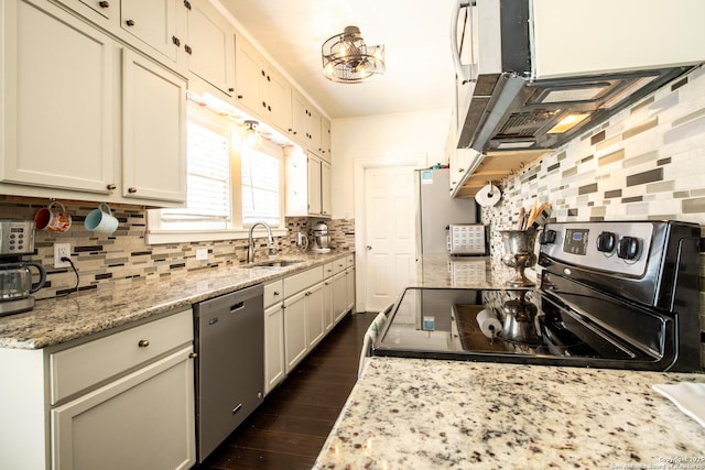 243 N, San Antonio, TX 78201 - kitchen featuring appliances with stainless steel finishes, a sink, backsplash, dark wood-type flooring, and extractor fan