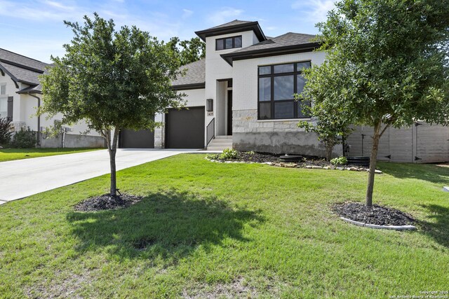 435 Bridle Trl, New Braunfels, TX 78132 - view of front of property with an attached garage, driveway, a shingled roof, and a front yard