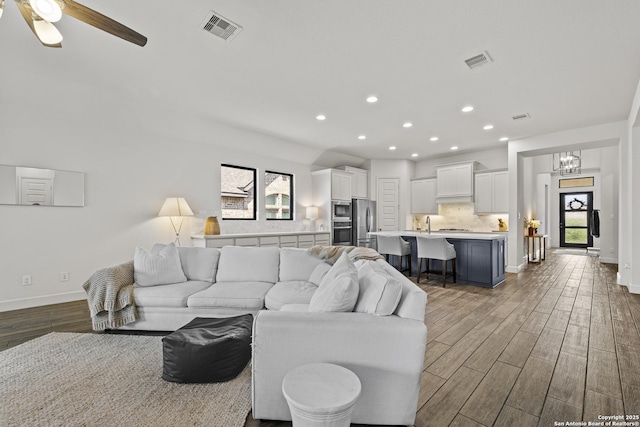 435 Bridle Trl, New Braunfels, TX 78132 - living room featuring wood finished floors, recessed lighting, baseboards, and a ceiling fan