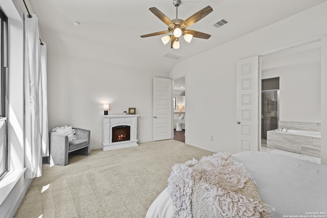 435 Bridle Trl, New Braunfels, TX 78132 - bedroom with a lit fireplace, carpet, lofted ceiling, ensuite bathroom, and ceiling fan