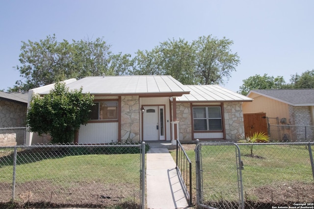 6614 Spring Hurst, San Antonio, TX 78249 - view of front of property featuring stone siding, a gate, a standing seam roof, and metal roof