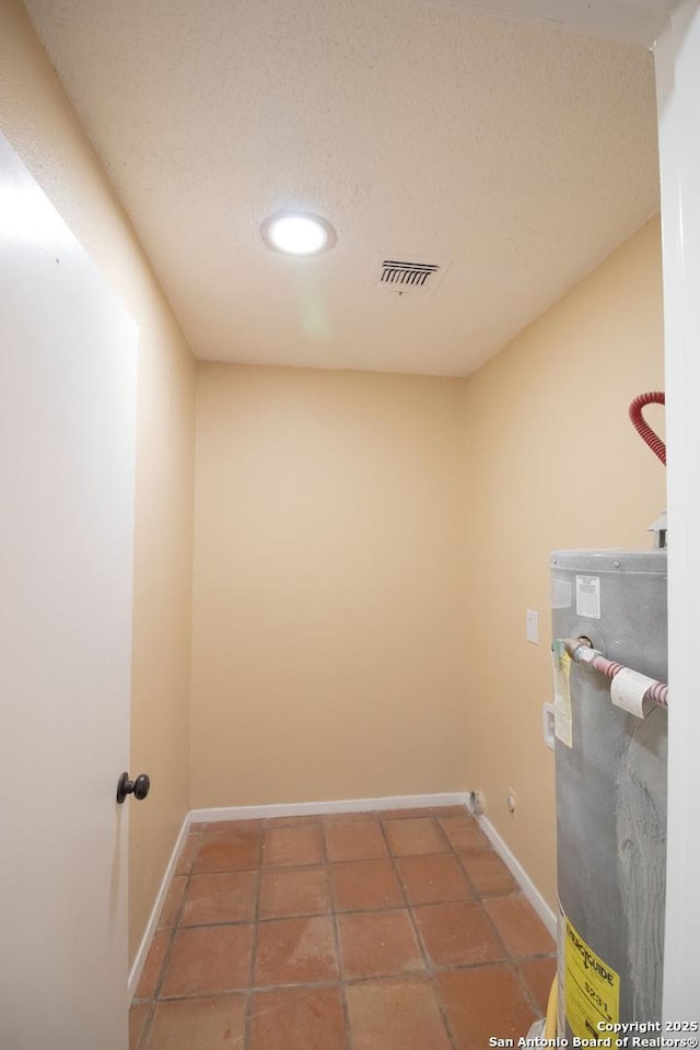 6614 Spring Hurst, San Antonio, TX 78249 - laundry room featuring gas water heater, baseboards, recessed lighting, and tile patterned flooring