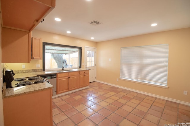 6614 Spring Hurst, San Antonio, TX 78249 - kitchen with stainless steel dishwasher, light brown cabinetry, a sink, light tile patterned floors, and recessed lighting