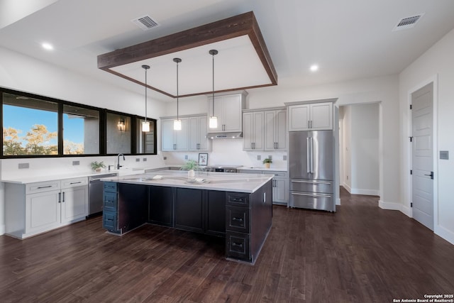 3045 Campestres, Spring Branch, TX 78070 - kitchen featuring appliances with stainless steel finishes, a sink, a kitchen island, dark wood-type flooring, and beamed ceiling