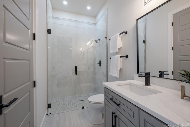 3045 Campestres, Spring Branch, TX 78070 - full bathroom featuring a shower stall, toilet, vanity, and recessed lighting