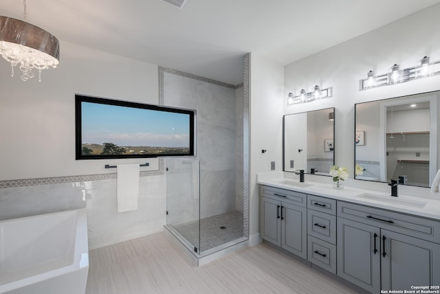 3045 Campestres, Spring Branch, TX 78070 - full bath with a chandelier, a soaking tub, a stall shower, and double vanity