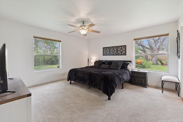 101 Cynthia, Pleasanton, TX 78064 - bedroom with multiple windows, baseboards, carpet, and ceiling fan