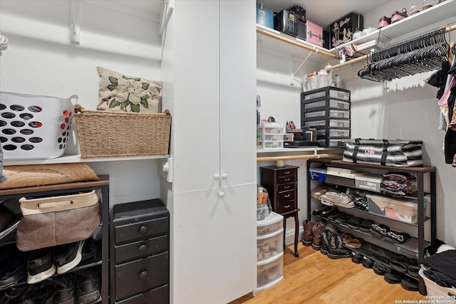 101 Cynthia, Pleasanton, TX 78064 - walk in closet featuring wood finished floors