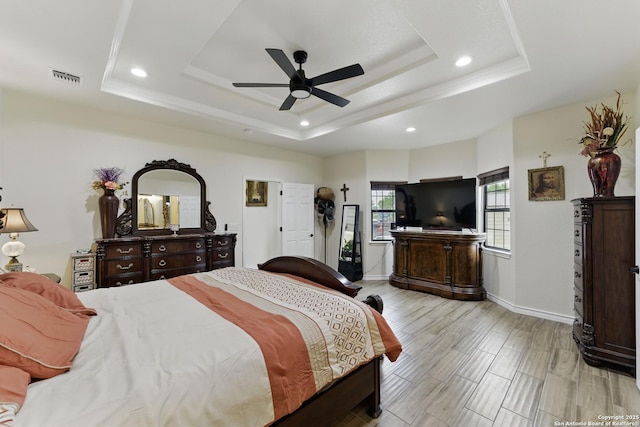 1110 Atascosa County Road 101, Floresville, TX 78114 - bedroom featuring a raised ceiling, recessed lighting, and baseboards