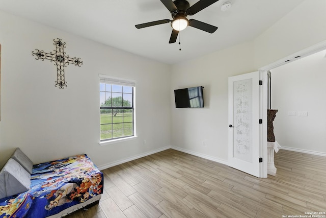 1110 Atascosa County Road 101, Floresville, TX 78114 - bedroom with light wood finished floors, baseboards, and ceiling fan