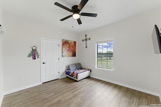 1110 Atascosa County Road 101, Floresville, TX 78114 - unfurnished bedroom with light wood finished floors, baseboards, and ceiling fan