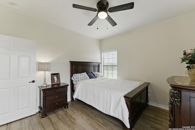 1110 Atascosa County Road 101, Floresville, TX 78114 - bedroom featuring wood finished floors, baseboards, and a ceiling fan