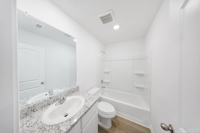 12056 Luckey Villa, San Antonio, TX 78252 - full bathroom with toilet, wood finished floors, vanity, and shower / bath combination