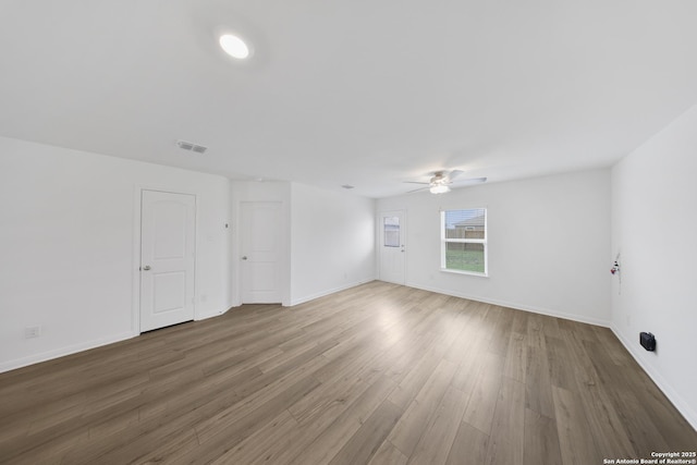 12056 Luckey Villa, San Antonio, TX 78252 - unfurnished room featuring a ceiling fan, wood finished floors, and baseboards