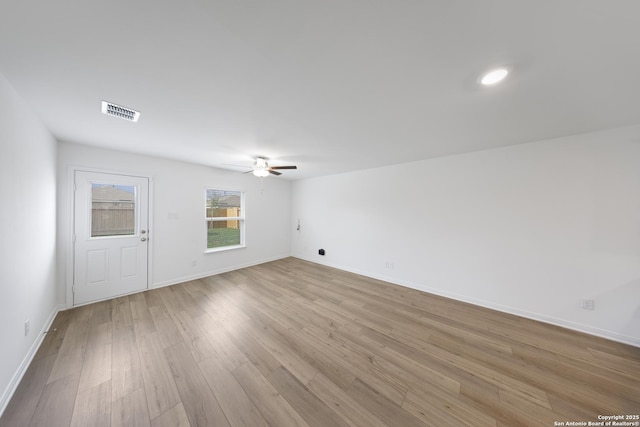 12056 Luckey Villa, San Antonio, TX 78252 - spare room featuring ceiling fan, light wood-style flooring, and baseboards