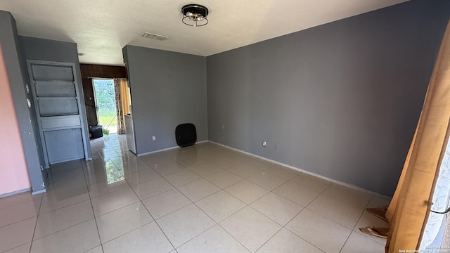 1906 Perlita, San Antonio, TX 78224 - empty room featuring baseboards and light tile patterned floors