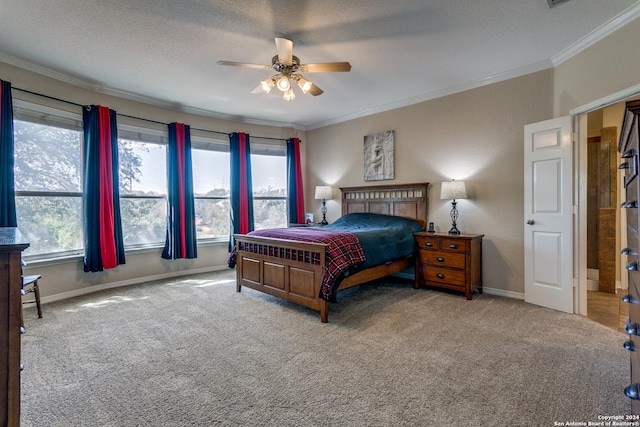 bedroom featuring ornamental molding, carpet flooring, baseboards, and a ceiling fan