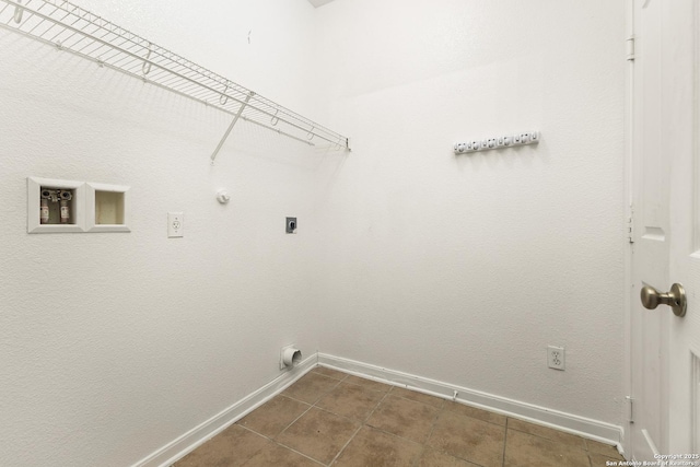 6739 Nora Vista Way, San Antonio, TX 78233 - laundry area with electric dryer hookup, baseboards, dark tile patterned flooring, and hookup for a gas dryer