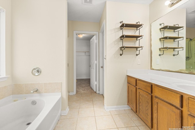 6739 Nora Vista Way, San Antonio, TX 78233 - full bath featuring tile patterned flooring, a bath, vanity, a walk in closet, and baseboards