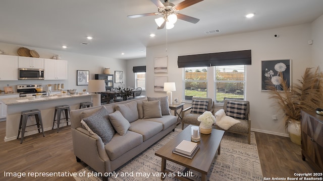 1435 Chianti Pass, New Braunfels, TX 78130 - living room with dark wood-style floors, ceiling fan, recessed lighting, and baseboards