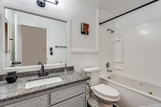 full bathroom with toilet, vanity, and washtub / shower combination