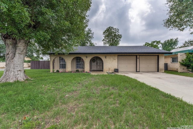 ranch-style house with a garage, concrete driveway, and brick siding