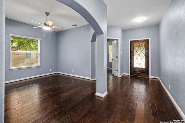 10607 Carmona, Helotes, TX 78023 - entrance foyer featuring ceiling fan, hardwood / wood-style flooring, arched walkways, and baseboards