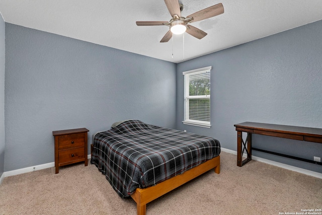 10607 Carmona, Helotes, TX 78023 - bedroom with carpet, baseboards, a ceiling fan, and a textured wall