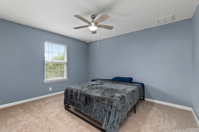 10607 Carmona, Helotes, TX 78023 - bedroom featuring baseboards, carpet flooring, and ceiling fan
