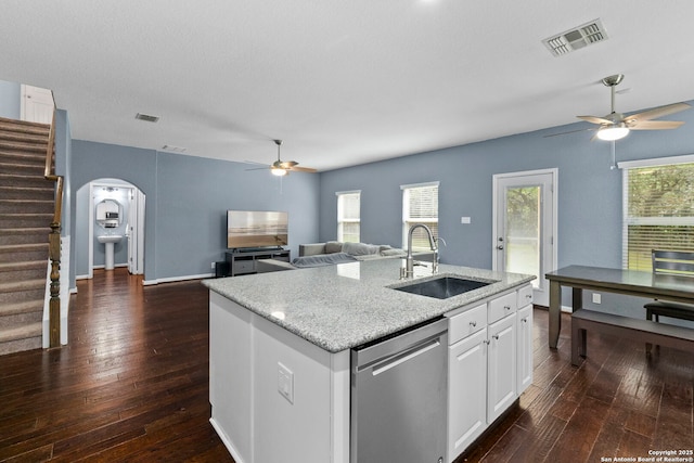 10607 Carmona, Helotes, TX 78023 - kitchen featuring a sink, a ceiling fan, dishwasher, and arched walkways