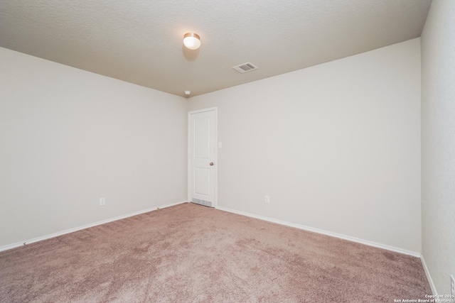 empty room with light carpet and baseboards